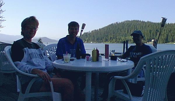 Mike, Deb, and Mark B. at the bar by the lake